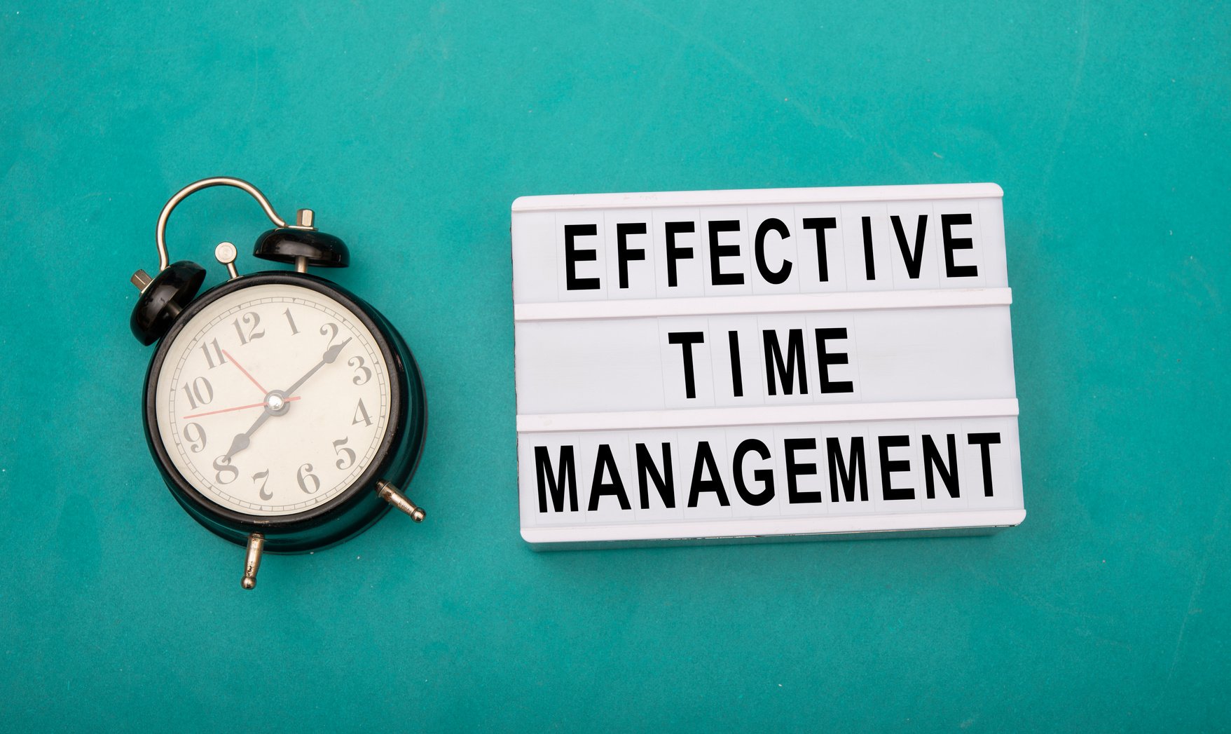 Effective time management sign with black clock on side